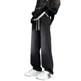 Japanese-style Drawstring Elastic-waist Jeans For Men showcased on a model with relaxed silhouette and adjustable drawstring.