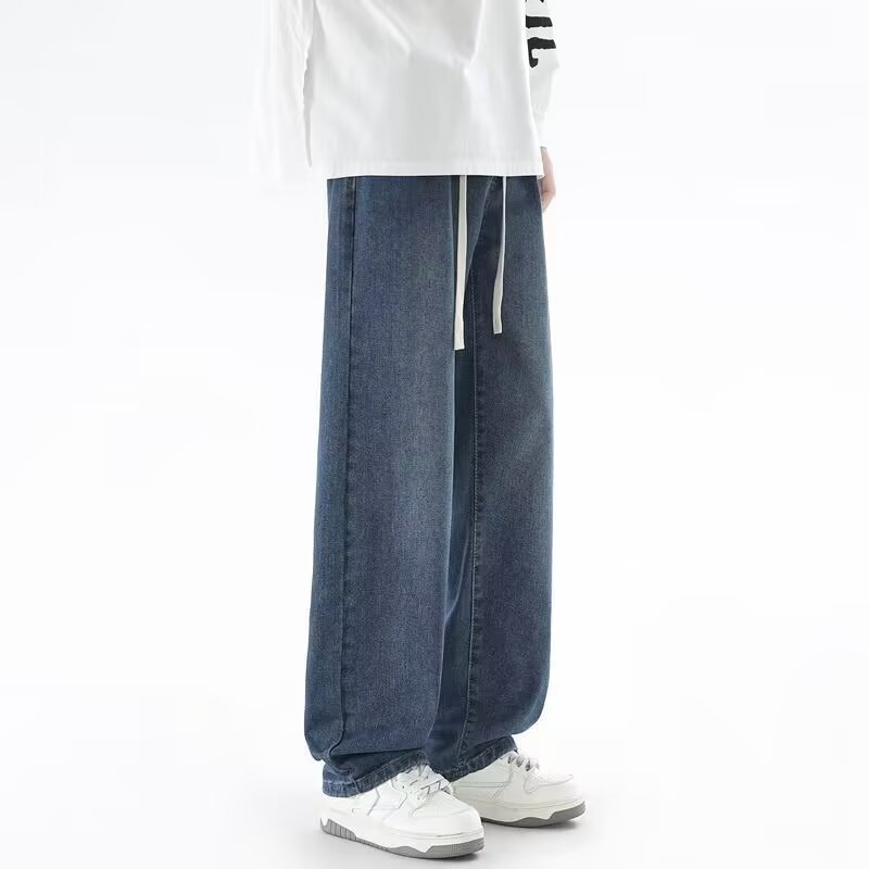 Japanese-style Drawstring Elastic-waist Jeans For Men worn with a relaxed fit and adjustable drawstring.