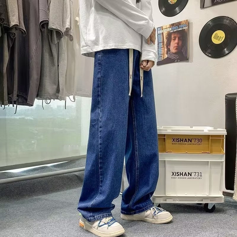 Japanese-style Drawstring Elastic-waist Jeans For Men showcased in a trendy outfit with relaxed fit and casual vibe.
